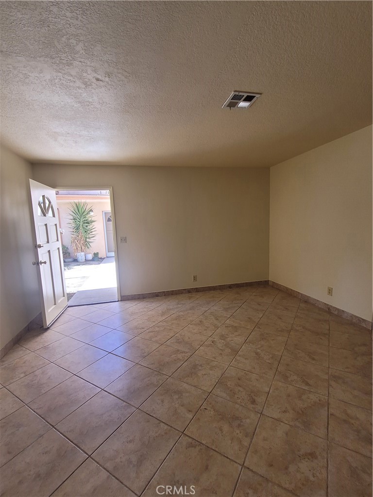 9229 Stewart And Gray Road, Unit D Downey, CA 90241 - Photo 3 of 19 a view of an empty room with a window