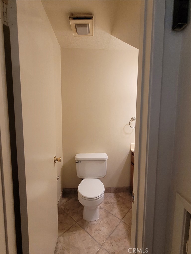 9229 Stewart And Gray Road, Unit D Downey, CA 90241 - Photo 6 of 19 a white toilet sitting next to a white wall