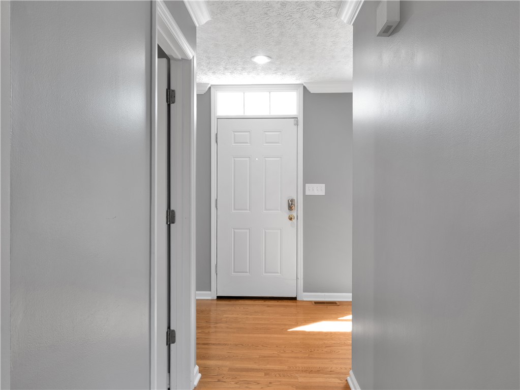 25 Callaway Springboro, OH 45066 - Photo 17 of 51 This inviting entryway features natural light and rich wood flooring.