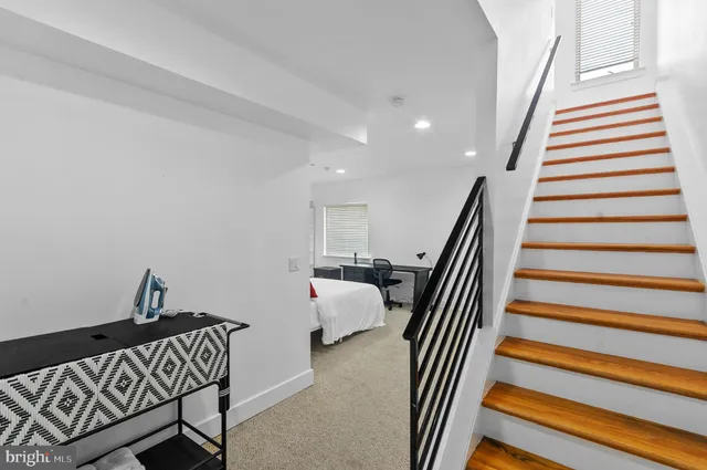 a bedroom with a bed and furniture