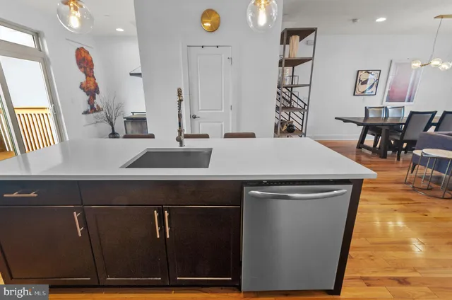 a white toilet sitting next to a bathroom sink