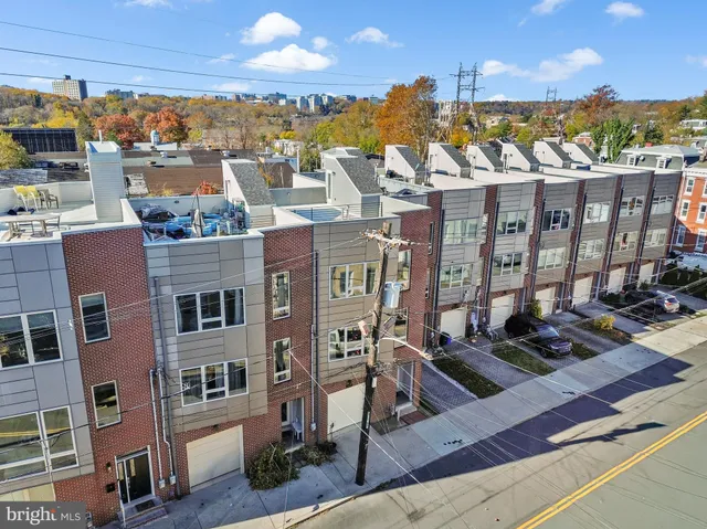 a view of a brick building with many windows