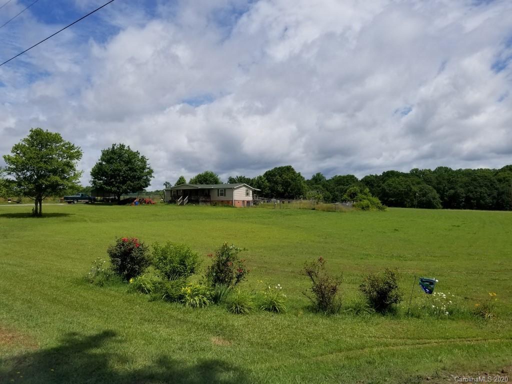3330 New Cut Road Inman, SC 29349 - Photo 1 of 14 a view of a golf course with a lake