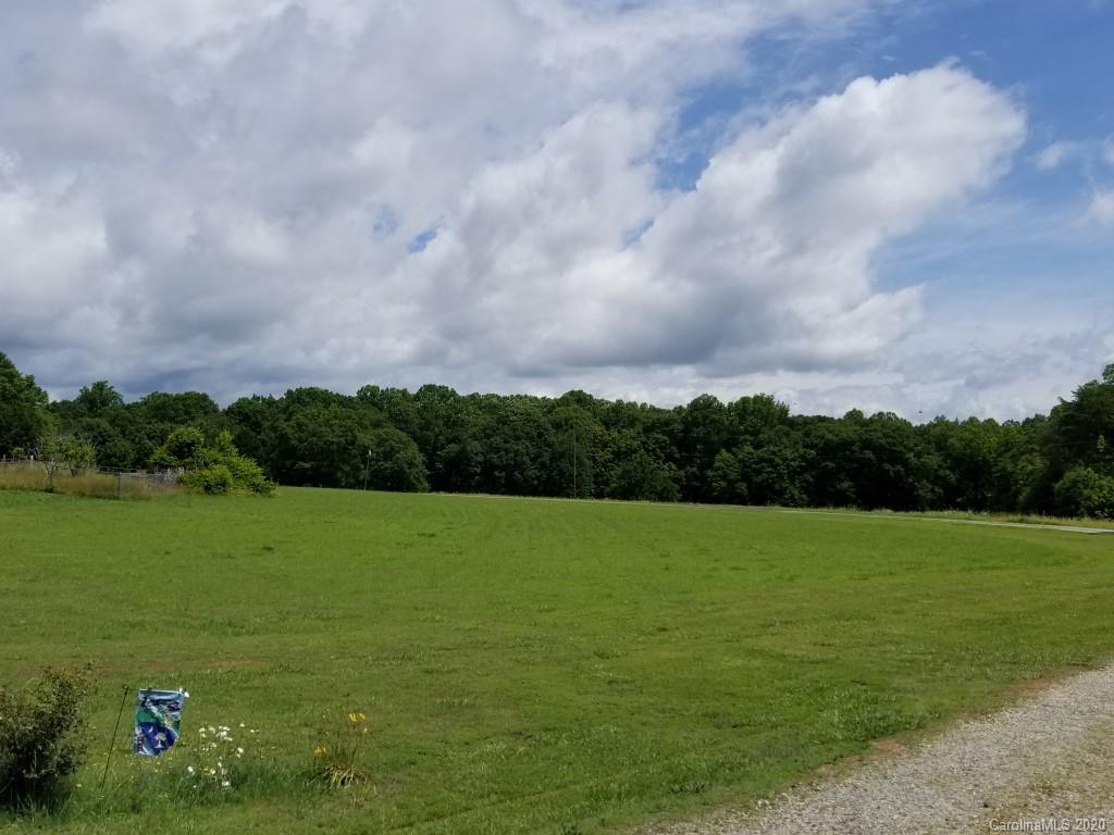 3330 New Cut Road Inman, SC 29349 - Photo 3 of 14 a view of a field with an trees in the background
