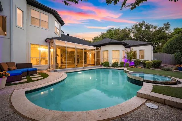a view of a house with backyard sitting area and garden