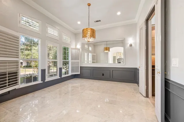 a view of an empty room with a kitchen