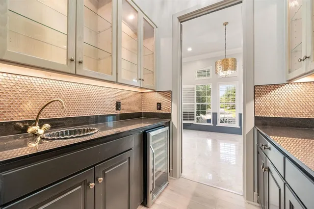 a kitchen with a sink and cabinets