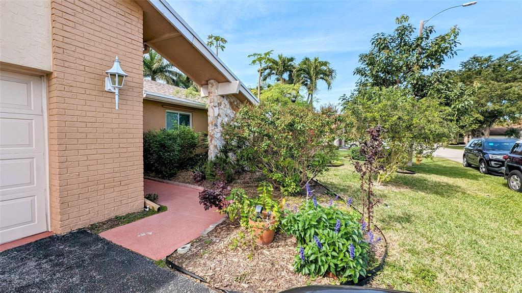 8105 Nutmeg Way Tamarac, FL 33321 - Photo 2 of 28 a front view of a house with garden