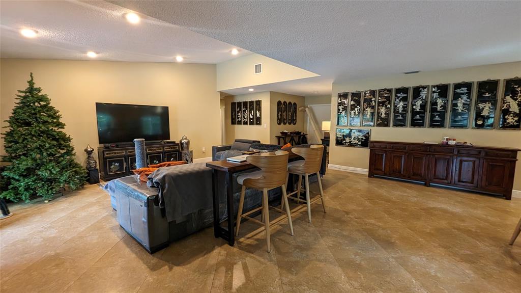 8105 Nutmeg Way Tamarac, FL 33321 - Photo 6 of 28 a living room with furniture and a flat screen tv