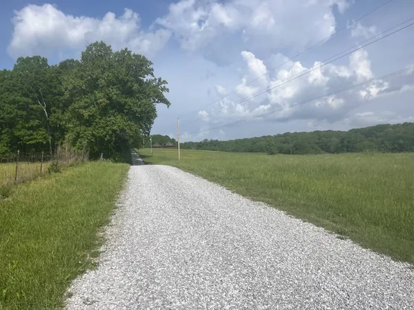 a view of a lake with a big yard