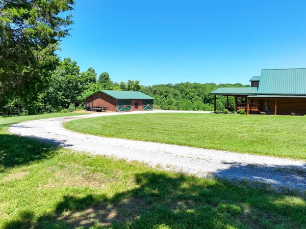 a view of a house with a big yard