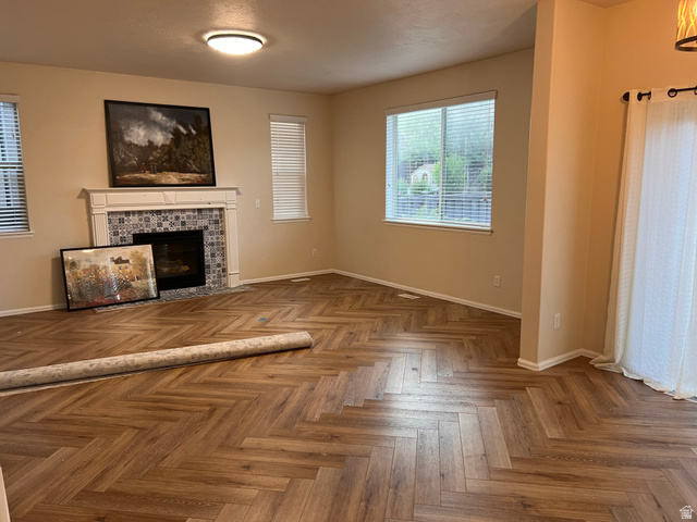 2001 Fielding Hill Lane Draper, UT 84020 - Photo 4 of 21 Unfurnished living room featuring a fireplace and parquet floors
