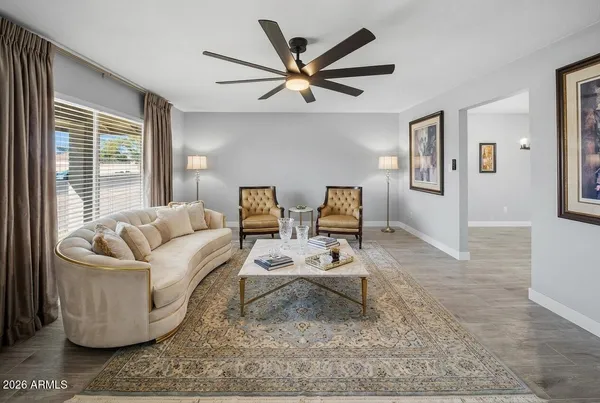 a living room with furniture and a window