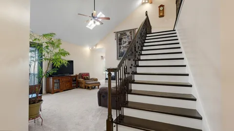 a view of a livingroom with a ceiling fan and a rug