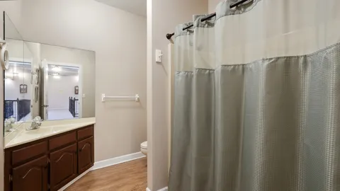 a bathroom with a bathtub and shower