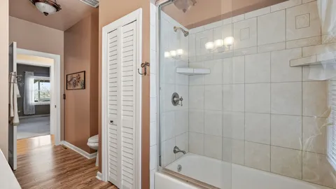 a view of house with backyard and trees