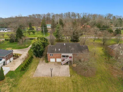 a view of swimming pool with a back yard