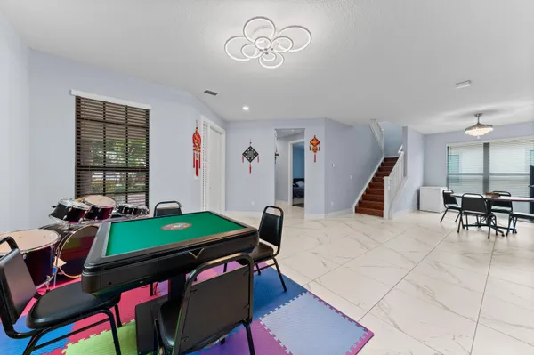 a view of a livingroom with furniture and window