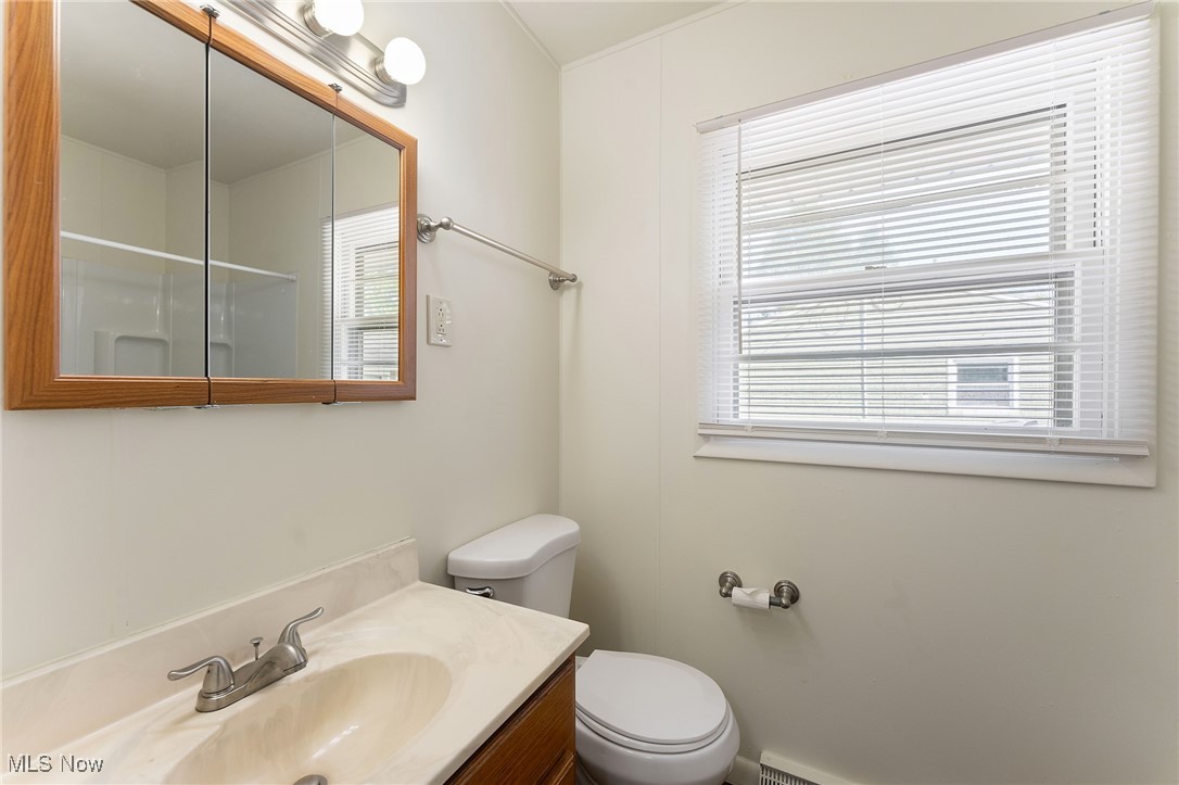 1723 Mathews Road Youngstown, OH 44514 - Photo 17 of 37 Bathroom featuring toilet, a shower, and vanity