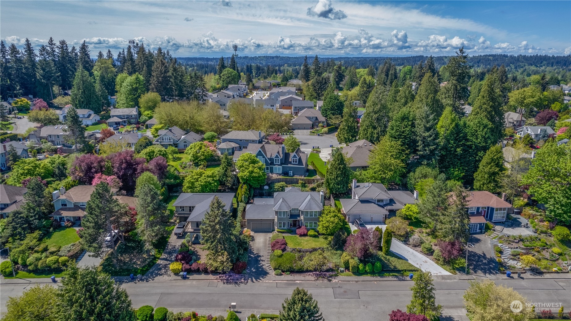 24202 26th Avenue Southeast Bothell, WA 98021 - Photo 33 of 37 a view of a garden with a building in the background