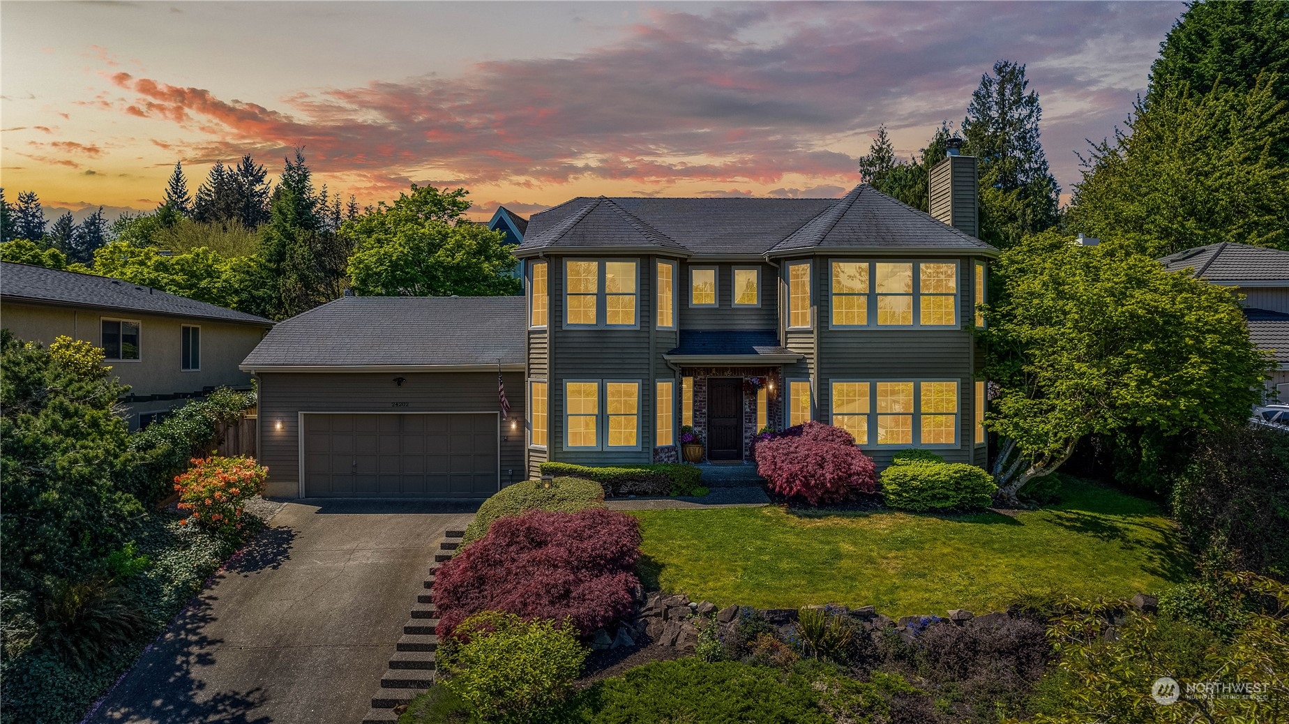 24202 26th Avenue Southeast Bothell, WA 98021 - Photo 37 of 37 a front view of a house with garden