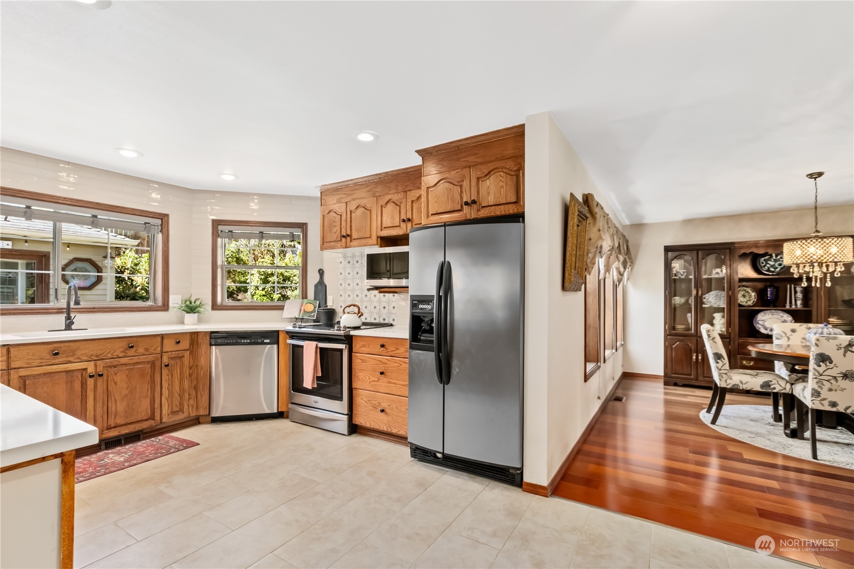 24202 26th Avenue Southeast Bothell, WA 98021 - Photo 10 of 37 a kitchen with stainless steel appliances granite countertop a refrigerator and a stove top oven