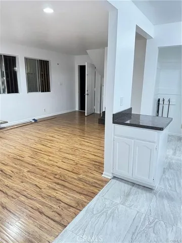 a view of a kitchen from an empty room