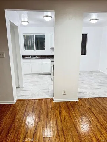 a view of a kitchen from the hallway