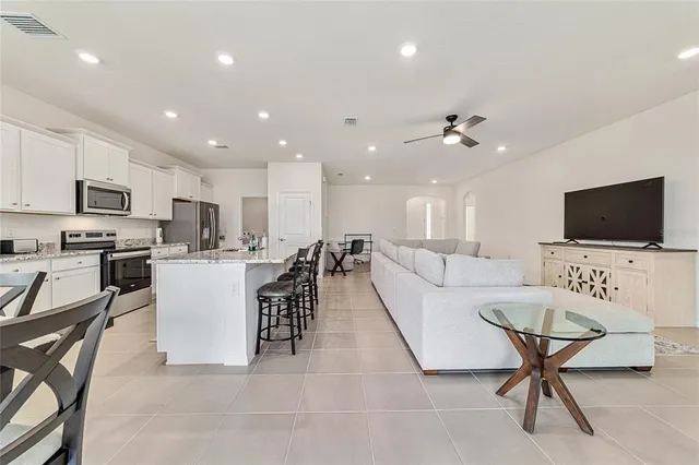 a view of a dining room with furniture and a window
