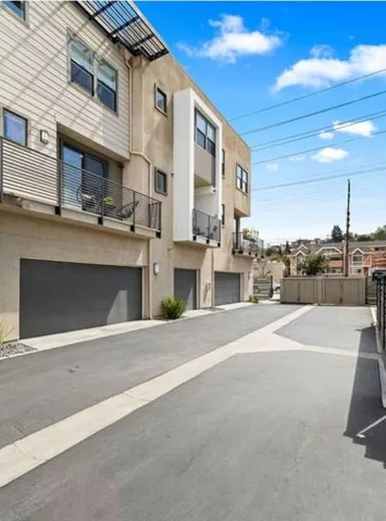 a view of a street with a building