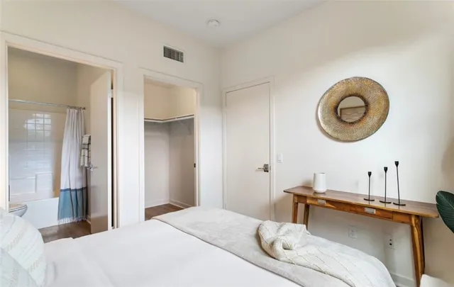 a bedroom with a bed and a cabinets