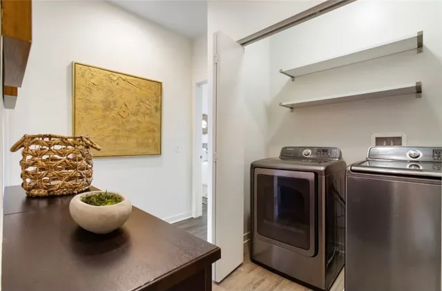 a living room with a couch and a wooden floor