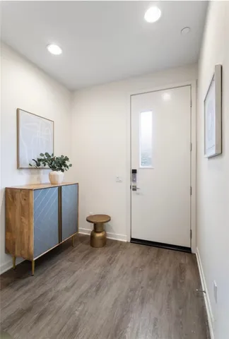 a view of a room with wooden floor