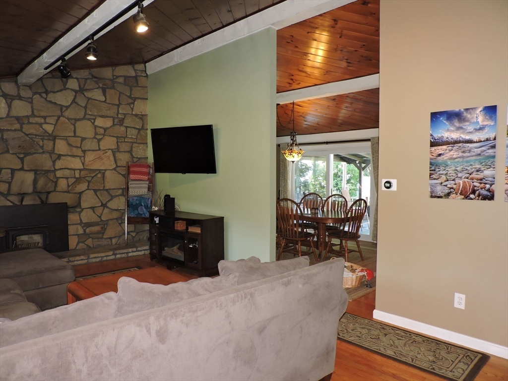 92 Lower Gore Road Webster, MA 01570 - Photo 13 of 42 a living room with furniture and a flat screen tv