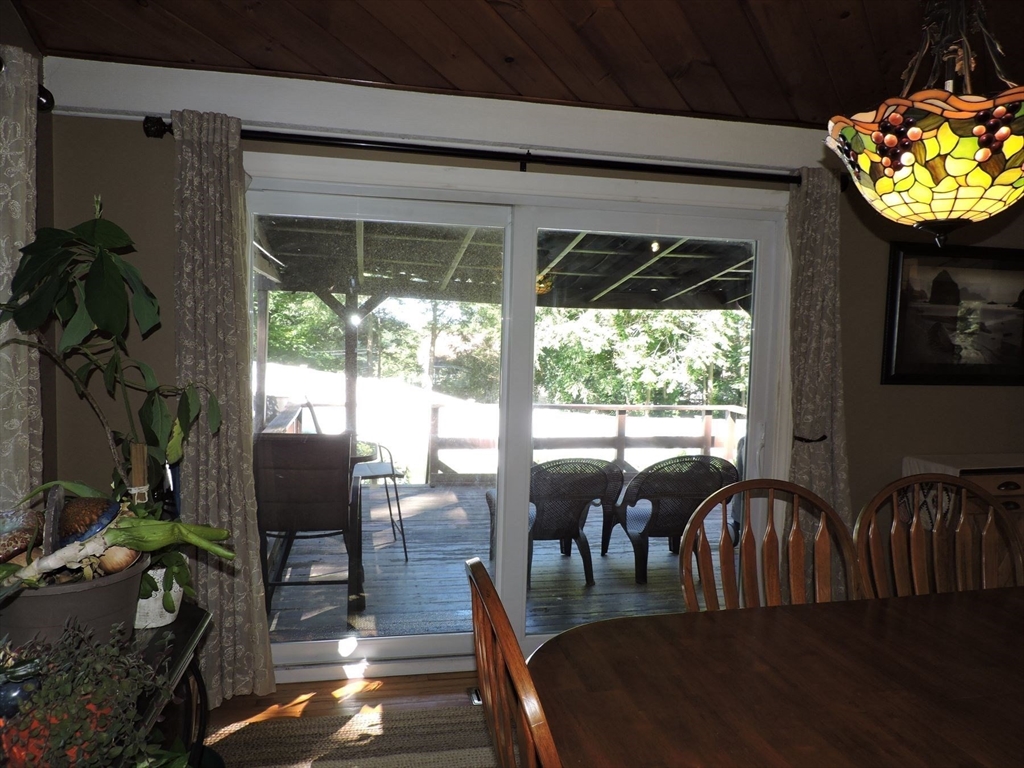 92 Lower Gore Road Webster, MA 01570 - Photo 17 of 42 a view of a dining room with furniture window and outside view