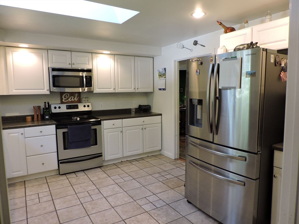 92 Lower Gore Road Webster, MA 01570 - Photo 18 of 42 a kitchen with a refrigerator sink and microwave