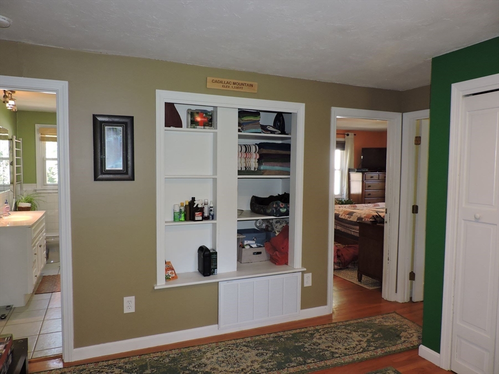92 Lower Gore Road Webster, MA 01570 - Photo 21 of 42 a view of a kitchen with refrigerator and wooden floor