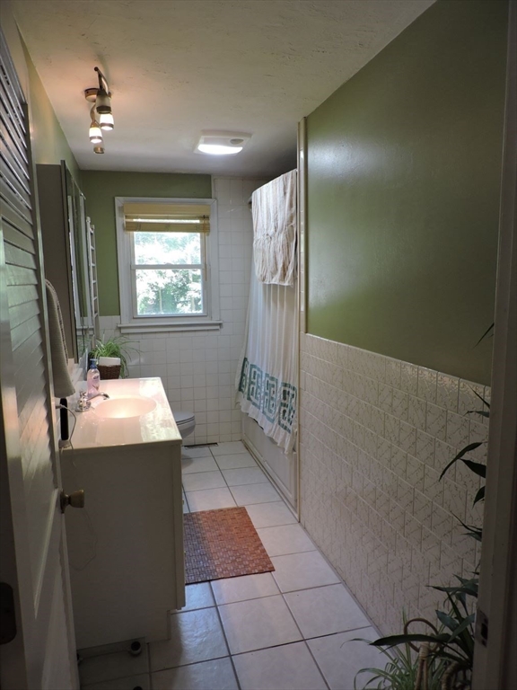 92 Lower Gore Road Webster, MA 01570 - Photo 23 of 42 a bathroom with a sink mirror vanity and toilet