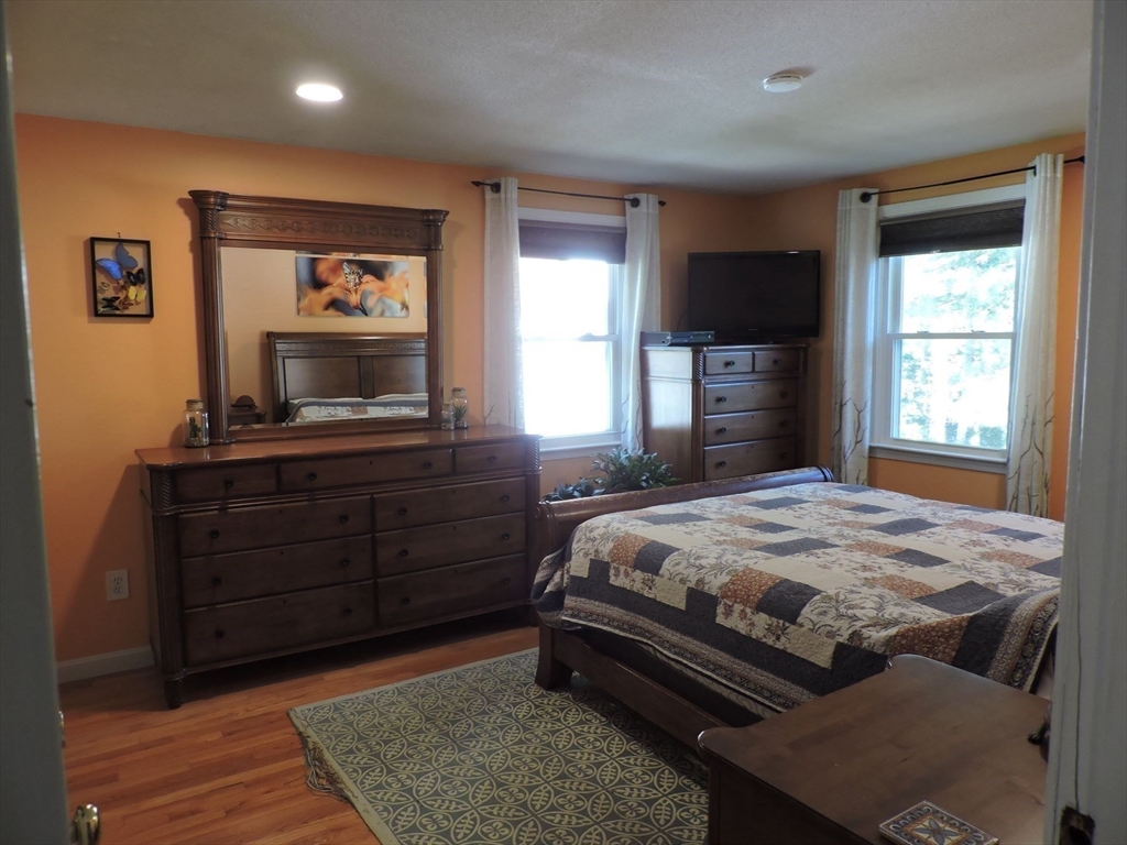 92 Lower Gore Road Webster, MA 01570 - Photo 24 of 42 a bedroom with a bed and a dresser