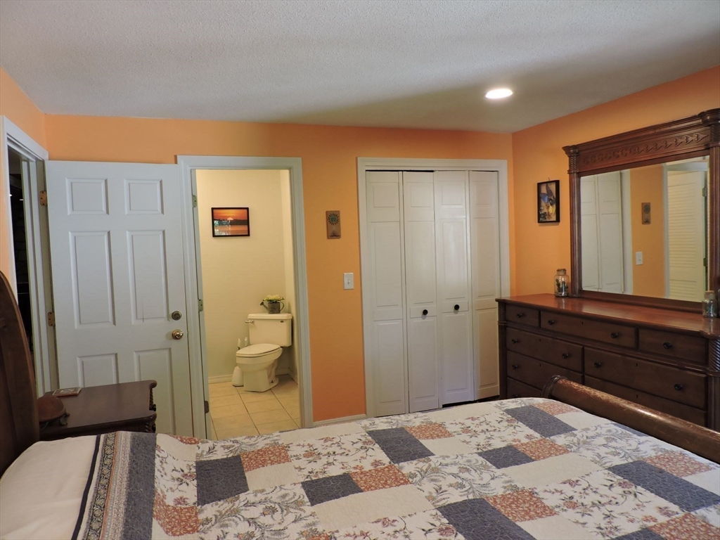 92 Lower Gore Road Webster, MA 01570 - Photo 25 of 42 a bedroom with a bed and a dresser