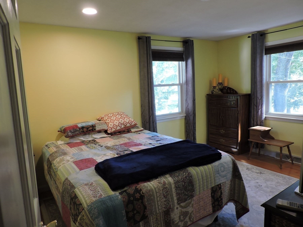92 Lower Gore Road Webster, MA 01570 - Photo 27 of 42 a bedroom with a bed and wooden floor