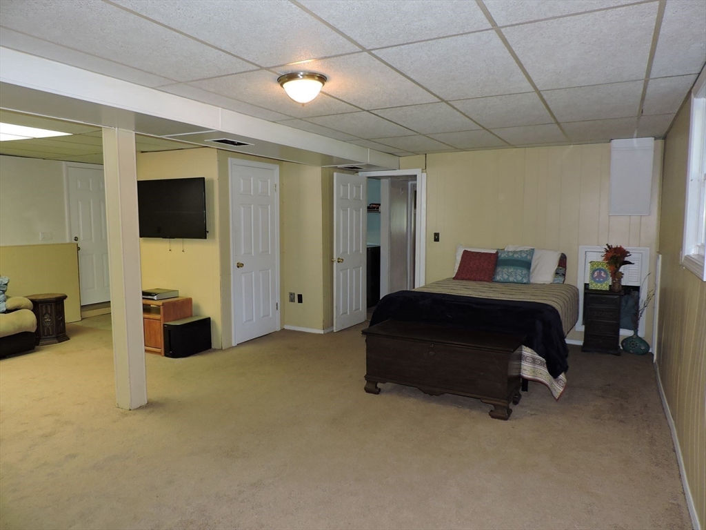 92 Lower Gore Road Webster, MA 01570 - Photo 28 of 42 a bedroom with a bed and a television