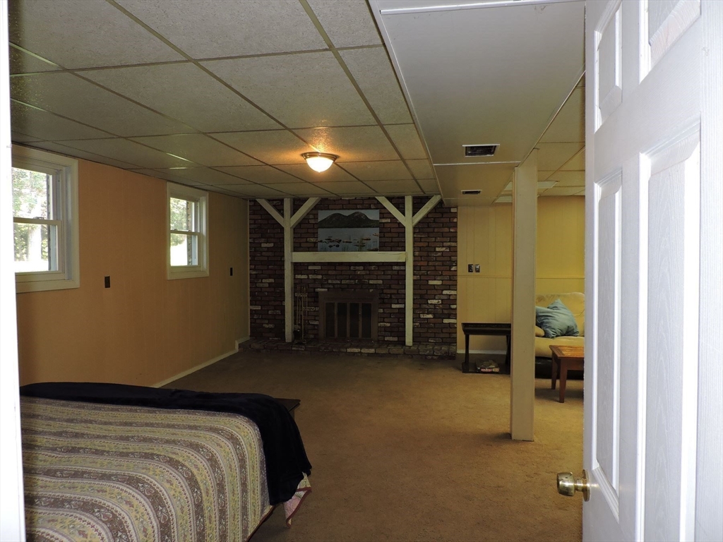 92 Lower Gore Road Webster, MA 01570 - Photo 29 of 42 a bed room with a bed and a tv