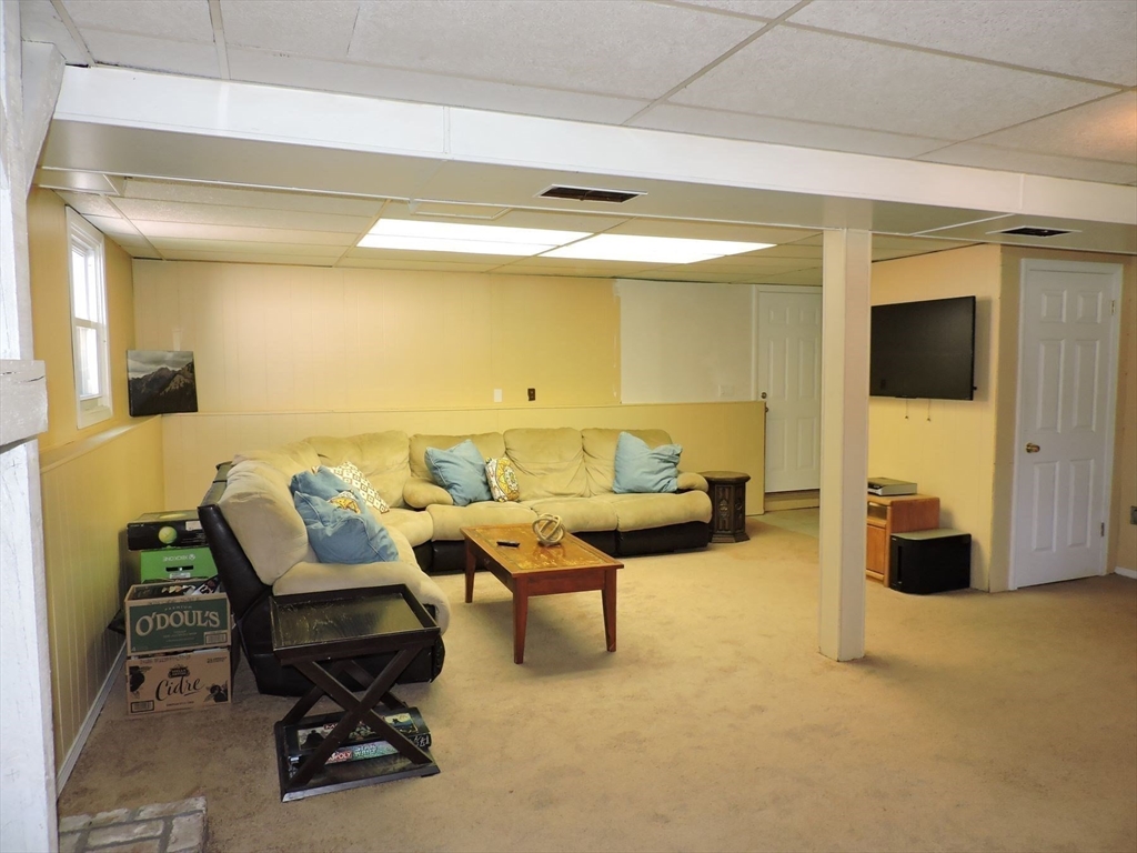 92 Lower Gore Road Webster, MA 01570 - Photo 31 of 42 a living room with furniture and a flat screen tv