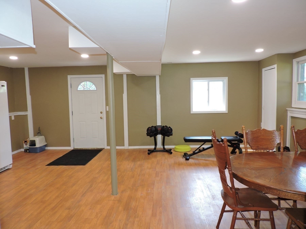 92 Lower Gore Road Webster, MA 01570 - Photo 36 of 42 a room with a table chairs and wooden floor
