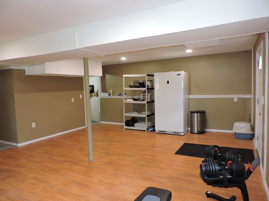 92 Lower Gore Road Webster, MA 01570 - Photo 37 of 42 a view of a livingroom with furniture and a kitchen