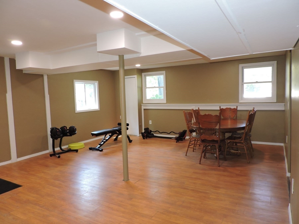 92 Lower Gore Road Webster, MA 01570 - Photo 38 of 42 a living room with furniture a window and wooden floor