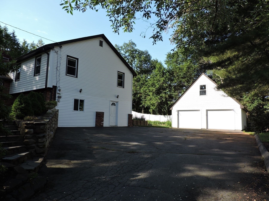 92 Lower Gore Road Webster, MA 01570 - Photo 6 of 42 a front view of a house with a yard