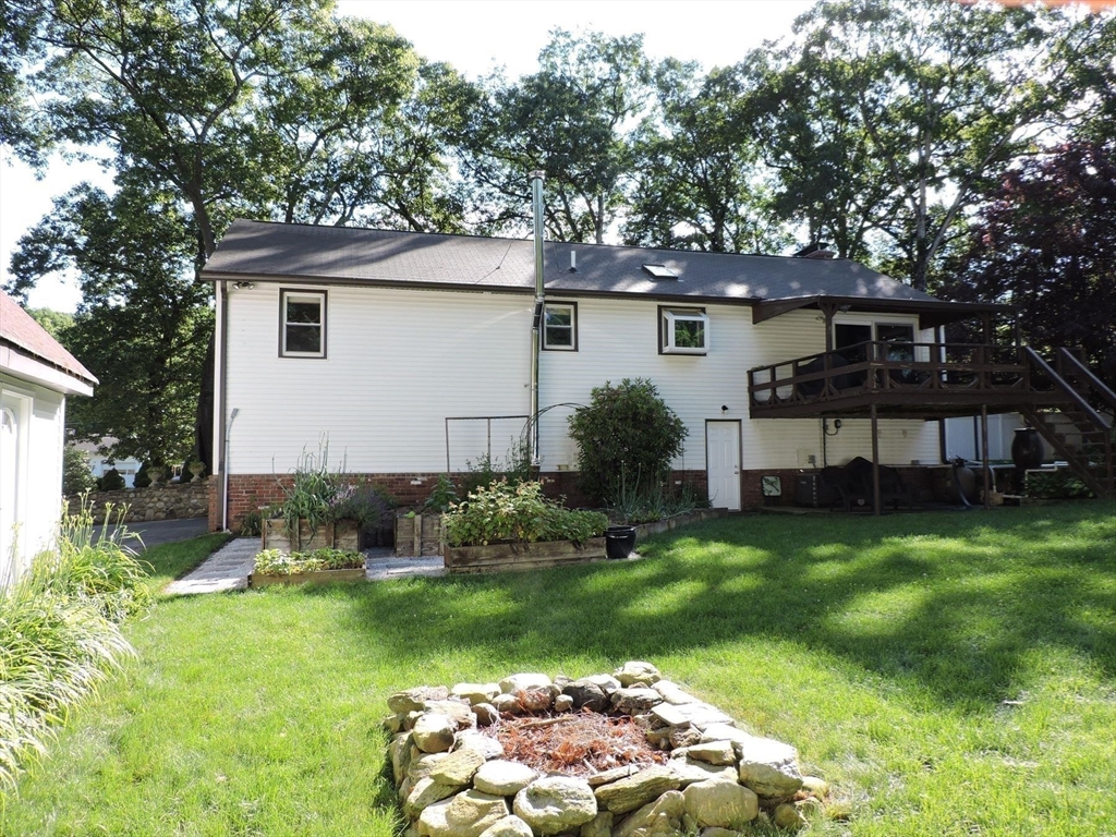 92 Lower Gore Road Webster, MA 01570 - Photo 8 of 42 a view of a house with a yard and sitting area
