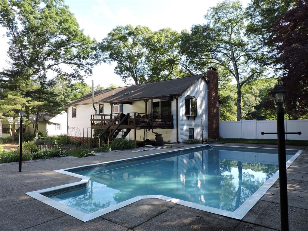 92 Lower Gore Road Webster, MA 01570 - Photo 9 of 42 a view of a small house with large trees in the background